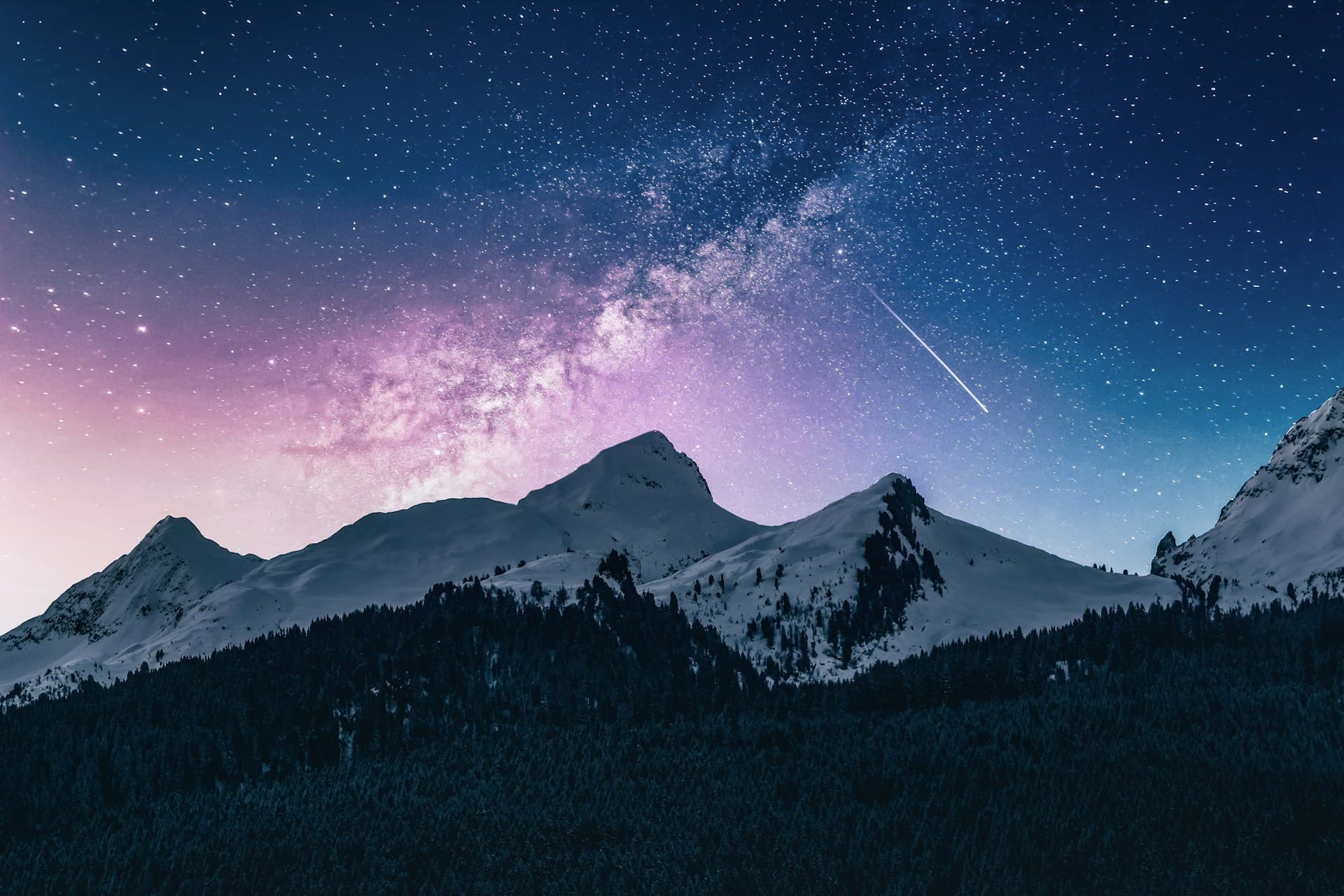 A night sky over a mountain ridge