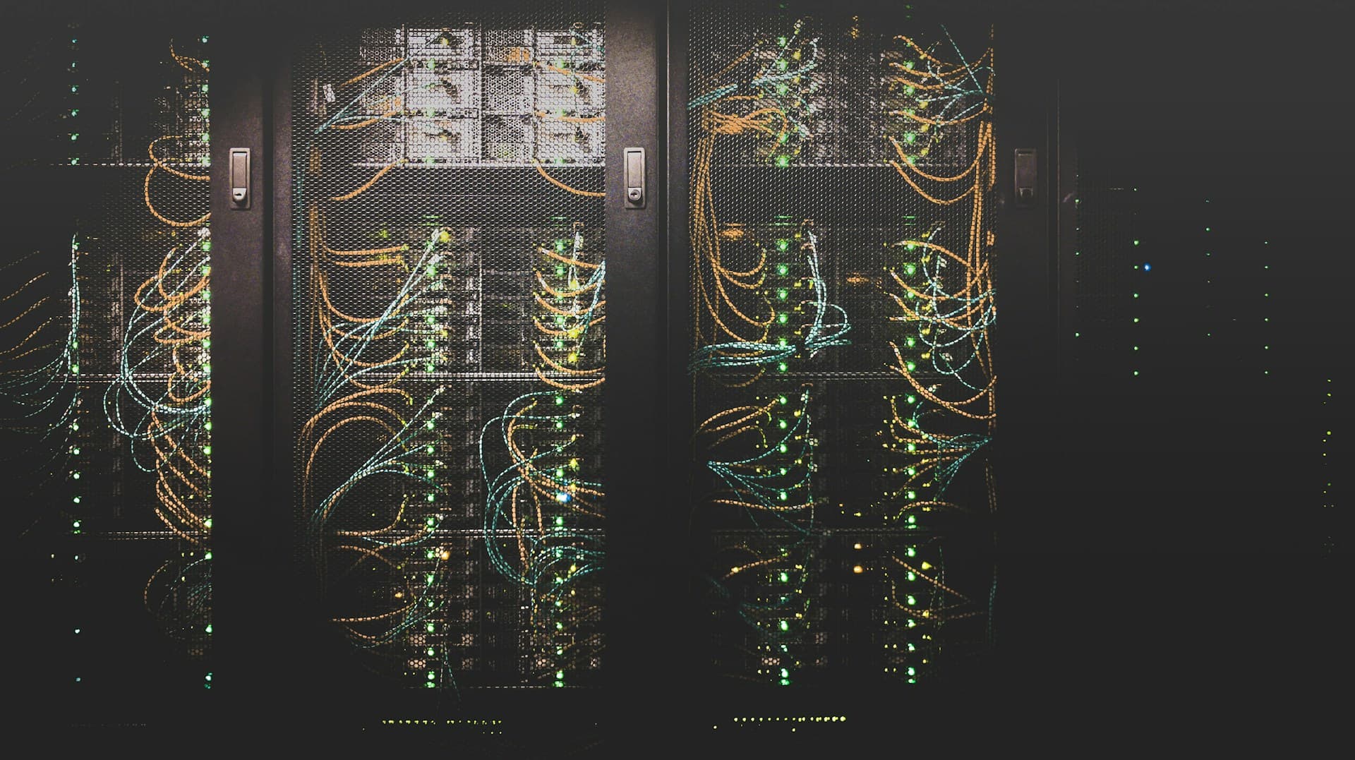 Network racks with fibre running across black doors